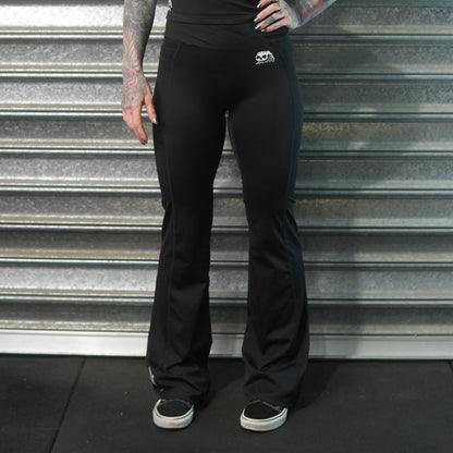 Black flared athletic pants with Dead Tide skull logo and dagger print – alternative gymwear by Dead Tide